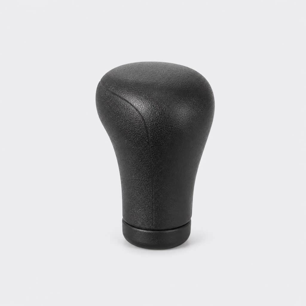 Pommeau de levier de vitesse compact présenté seul sur fond clair